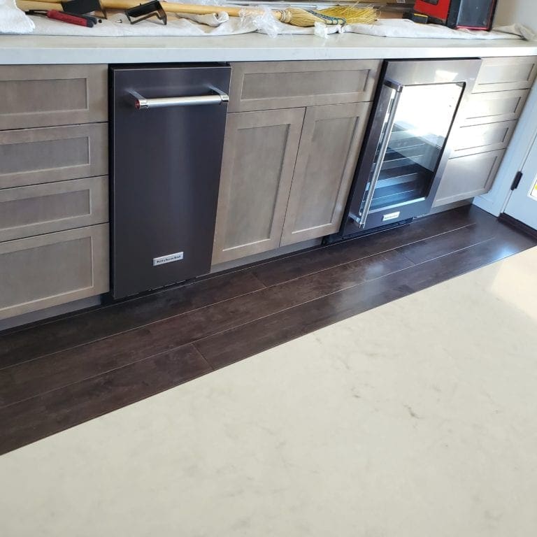 Finish of the kitchen with trash compactor and wine fridge.