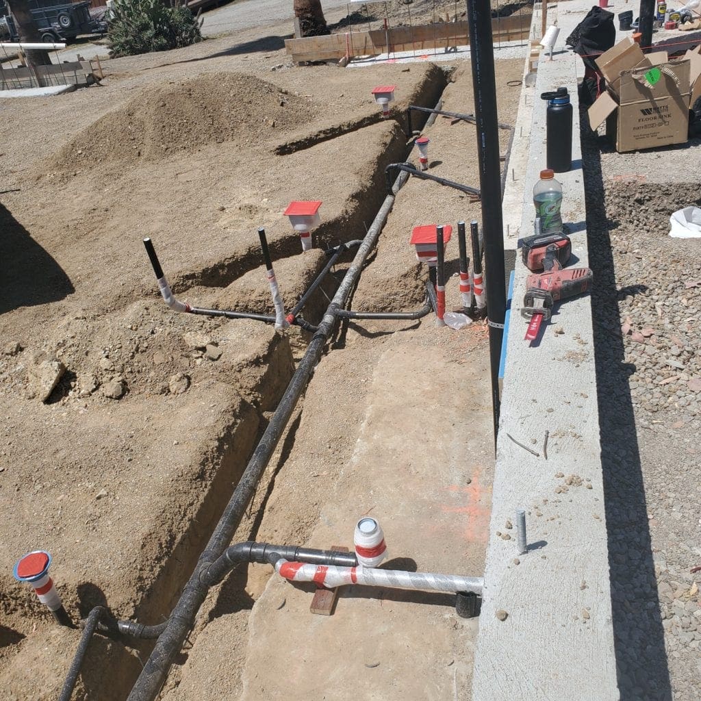 Very long trench for new restaraunt and drain pipes installed.